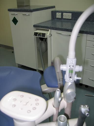 High volume evacuator (HVE) port on a dental chair